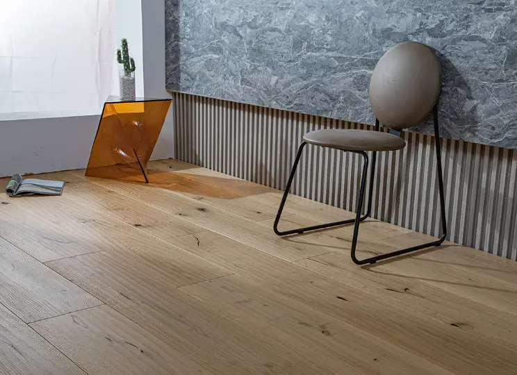 What are the performance benefits of water-based wood flooring in luxury hotels